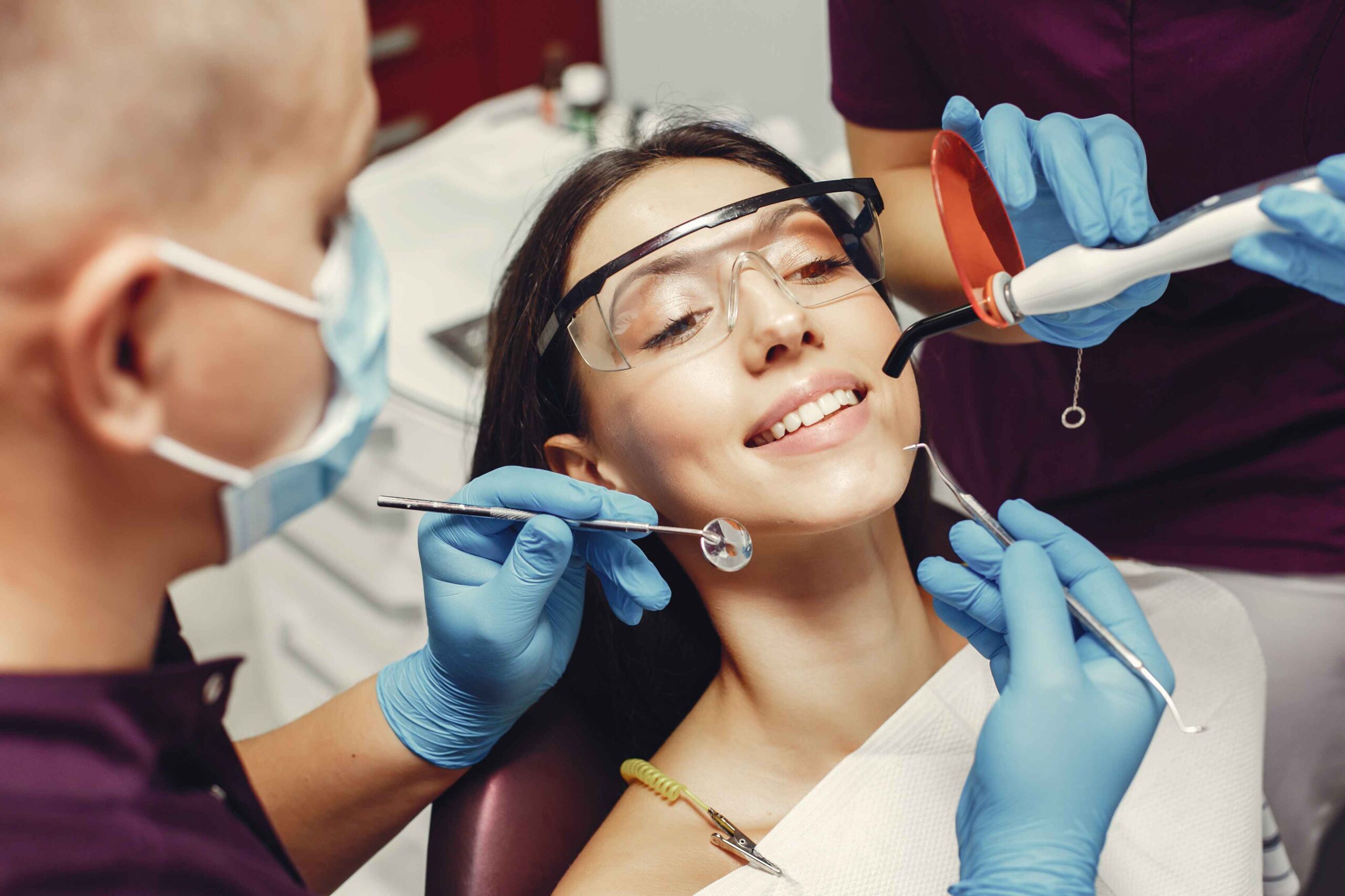 girl with sunglasses treated her teeth