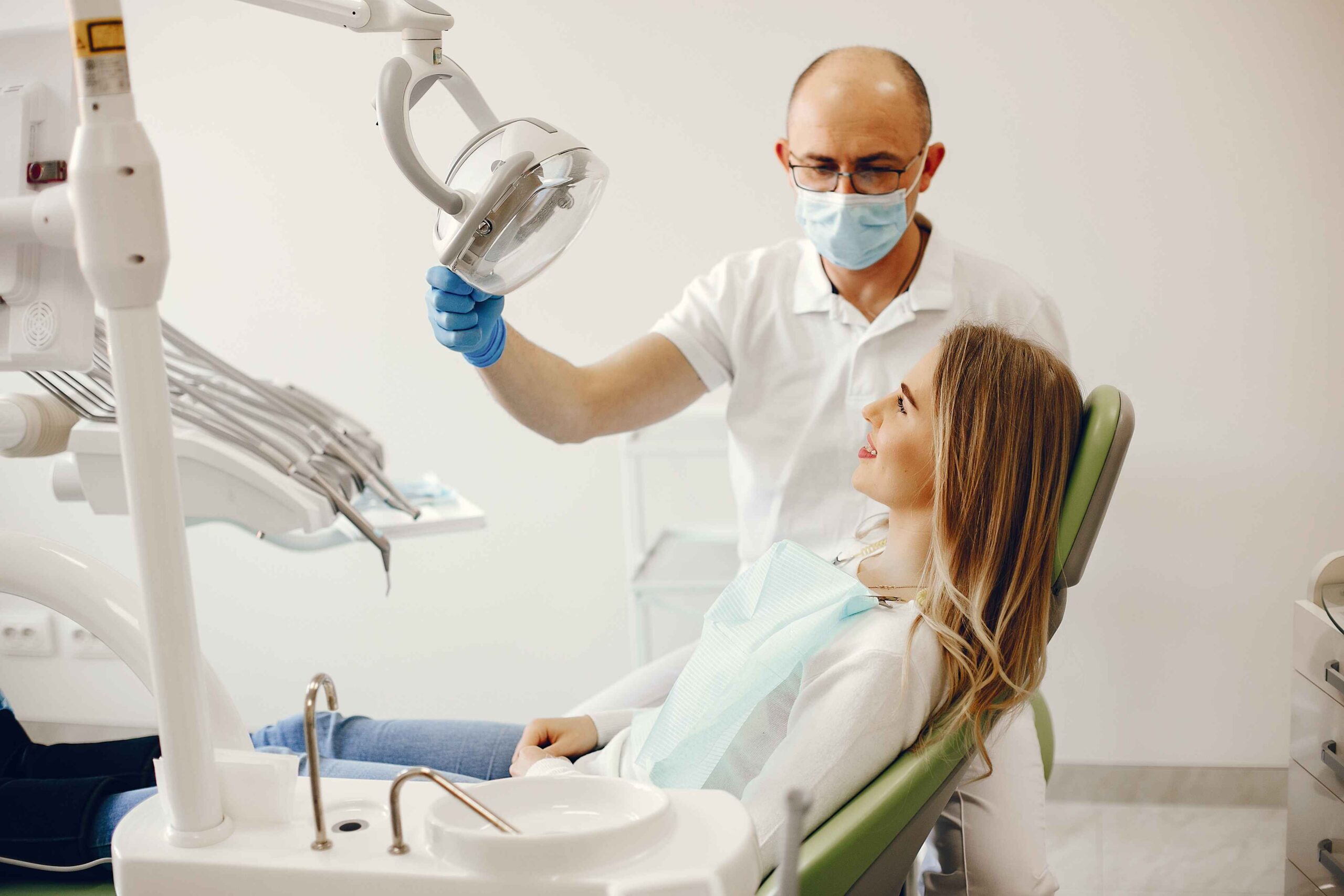 man check her teeth via machine